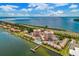 Aerial showcasing the condominiums' waterfront location, with community pool, dock, tennis court and lush surroundings at 7430 Sunshine Skyway S Ln # 602, St Petersburg, FL 33711