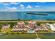 Beautiful aerial view showcasing waterfront condo complex with mature landscaping at 7430 Sunshine Skyway S Ln # 602, St Petersburg, FL 33711