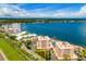 Stunning aerial view showcasing the complex near the water, pools, docks, and beautiful landscaped grounds at 7430 Sunshine Skyway S Ln # 602, St Petersburg, FL 33711