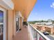 Wide balcony with a seating area and expansive views of the community and waterway at 7430 Sunshine Skyway S Ln # 602, St Petersburg, FL 33711