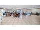 Spacious clubhouse featuring wicker chairs and tables, perfect for entertaining guests or enjoying community events at 7430 Sunshine Skyway S Ln # 602, St Petersburg, FL 33711