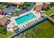 Aerial shot of a community pool, waterfront views, and comfortable lounge seating at 7430 Sunshine Skyway S Ln # 602, St Petersburg, FL 33711