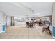Large community room with a dining area, seating, and kitchen space for residents at 7430 Sunshine Skyway S Ln # 602, St Petersburg, FL 33711