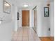 Bright entryway features tile floors, mirrored closet doors, and a coat closet at 7430 Sunshine Skyway S Ln # 602, St Petersburg, FL 33711