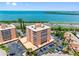 Condo exterior with parking, and distant water views at 7430 Sunshine Skyway S Ln # 602, St Petersburg, FL 33711