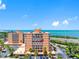 Waterfront condos feature private balconies offering stunning bay views, a well maintained building and palm tree landscaping at 7430 Sunshine Skyway S Ln # 602, St Petersburg, FL 33711