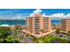 Stunning exterior view of the beachfront condo buildings boasting multiple stories and balconies with ocean views at 7430 Sunshine Skyway S Ln # 602, St Petersburg, FL 33711