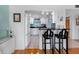 Open concept featuring kitchen bar with seating, tile floors and an open view to the living room at 7430 Sunshine Skyway S Ln # 602, St Petersburg, FL 33711