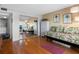 Relaxing living room with daybed, closet mirror, and sliding glass door to balcony with water views at 7430 Sunshine Skyway S Ln # 602, St Petersburg, FL 33711