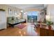 Inviting living room features a daybed, hardwood floors, and a sliding glass door with a water view at 7430 Sunshine Skyway S Ln # 602, St Petersburg, FL 33711