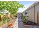 Backyard showcasing landscaping, a privacy fence, and the home's exterior at 744 53Rd N Ter, St Petersburg, FL 33703