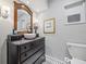 Elegant bathroom vanity featuring a vessel sink, stylish fixtures, and a decorative mirror at 744 53Rd N Ter, St Petersburg, FL 33703