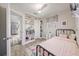 Bright bedroom with built-in shelving, single bed, and a cozy, inviting ambiance at 744 53Rd N Ter, St Petersburg, FL 33703