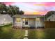 Charming single-story home featuring a well-manicured lawn and inviting front porch with decorative stepping stones at 744 53Rd N Ter, St Petersburg, FL 33703