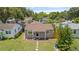 Charming single story home with a well-manicured lawn and a welcoming front entrance with stepping stones at 744 53Rd N Ter, St Petersburg, FL 33703