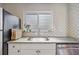 Charming kitchen features granite counters, stainless steel appliances, and patterned backsplash at 744 53Rd N Ter, St Petersburg, FL 33703
