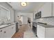 Modern kitchen featuring stainless steel appliances, granite countertops, and ample cabinet space at 744 53Rd N Ter, St Petersburg, FL 33703