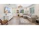 Bright living room with hardwood floors, modern lighting, and a comfortable seating area, perfect for relaxing at 744 53Rd N Ter, St Petersburg, FL 33703