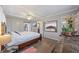 A bedroom featuring a wooden bed frame, luxury vinyl plank flooring, and access to the bathroom at 744 53Rd N Ter, St Petersburg, FL 33703