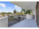 Relax on this spacious balcony with black iron railing and enjoy the surrounding neighborhood views at 80 Rogers St # 2D, Clearwater, FL 33756