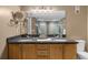Bathroom with a double vanity, large mirror, and shower at 80 Rogers St # 2D, Clearwater, FL 33756