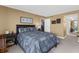 Comfortable bedroom with a bed, mirrored closet, and a view to the rest of the home at 80 Rogers St # 2D, Clearwater, FL 33756