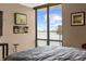 Bedroom with a waterfront view, art, and natural light at 80 Rogers St # 2D, Clearwater, FL 33756