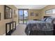 Bedroom showcases water views, a decorative mirror, and minimalist style at 80 Rogers St # 2D, Clearwater, FL 33756