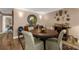 Nicely appointed dining room with hardwood floors and decorative mirror at 80 Rogers St # 2D, Clearwater, FL 33756