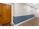 Condo entrance featuring a stylish door, modern wall accents, and wood-look flooring for a welcoming entry at 80 Rogers St # 2D, Clearwater, FL 33756