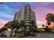 Exterior shot of the Prelude 80 condo with an attractive entrance and well maintained landscaping around the property at 80 Rogers St # 2D, Clearwater, FL 33756