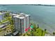 Stunning high-rise waterfront condo building with lush landscaping, community pool, and city views at 80 Rogers St # 2D, Clearwater, FL 33756
