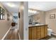 Bathroom entrance with double vanity and walk-in shower at 80 Rogers St # 2D, Clearwater, FL 33756