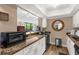 Bright kitchen with granite counters offers views to the living area at 80 Rogers St # 2D, Clearwater, FL 33756