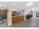 This is a kitchenette with wood cabinets, stainless steel appliances, and a view to the dining area at 80 Rogers St # 2D, Clearwater, FL 33756