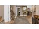 Open-concept living room with neutral paint, modern decor, and wood-look floors, creating a cozy atmosphere at 80 Rogers St # 2D, Clearwater, FL 33756