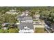 Neighborhood aerial view reveals neatly kept homes with fenced yards and tree-lined streets at 8074 37Th N Ave, St Petersburg, FL 33710