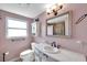 Bathroom featuring a decorative mirror, vanity with marble countertop, and traditional fixtures at 8074 37Th N Ave, St Petersburg, FL 33710