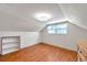Bedroom with wood floor, closet, built in shelving and a large window with shade at 8074 37Th N Ave, St Petersburg, FL 33710