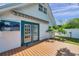 Exterior view from the back deck featuring french doors and a retractable awning at 8074 37Th N Ave, St Petersburg, FL 33710