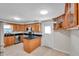 Well-lit kitchen features granite countertops, stainless steel appliances, and tile flooring at 8074 37Th N Ave, St Petersburg, FL 33710
