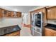 Eat-in kitchen featuring stainless steel appliances, granite countertops and hardwood cabinets at 8074 37Th N Ave, St Petersburg, FL 33710