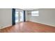 Open living room featuring wood floors and double doors leading to an outdoor space at 8074 37Th N Ave, St Petersburg, FL 33710