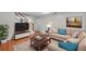Inviting living room with hardwood floors, soft lighting and a large picture window at 8074 37Th N Ave, St Petersburg, FL 33710