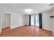Open living room featuring wood floors and double doors leading to an outdoor space at 8074 37Th N Ave, St Petersburg, FL 33710