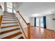 Staircase leads to a living room with french doors and wood floors at 8074 37Th N Ave, St Petersburg, FL 33710