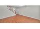 Living room featuring wood floors and staircase with white risers at 8074 37Th N Ave, St Petersburg, FL 33710