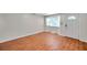 Bright living room with wood floors, and a large window at 8074 37Th N Ave, St Petersburg, FL 33710