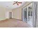 Bedroom with sliding door to lanai and view of the backyard at 9242 Brindlewood Dr, Odessa, FL 33556