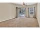 Large bedroom with sliding glass doors to pool area and natural light at 9242 Brindlewood Dr, Odessa, FL 33556